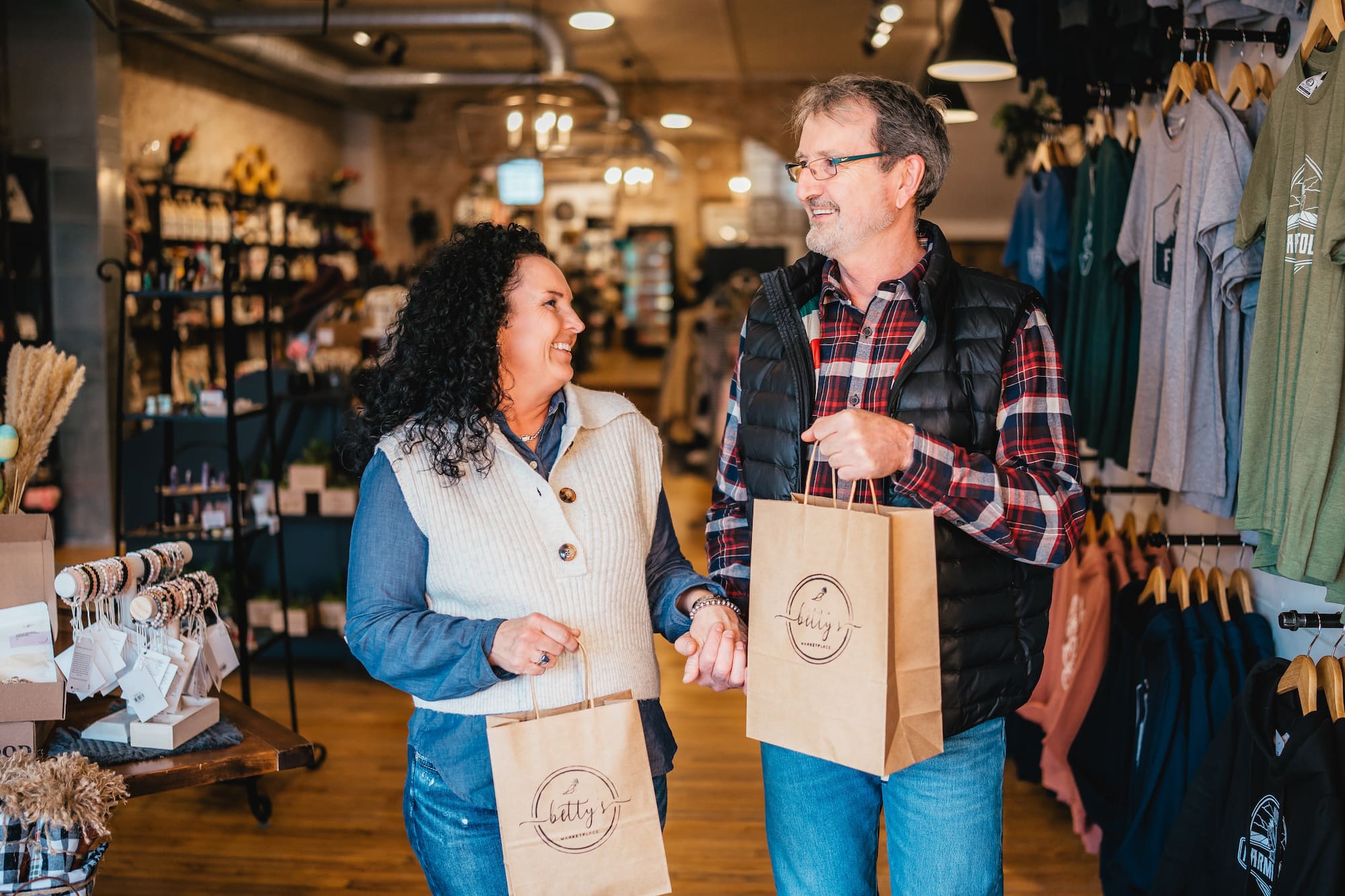 Two shoppers outside Betty’s Marketplace storefront, representing local shopping and community